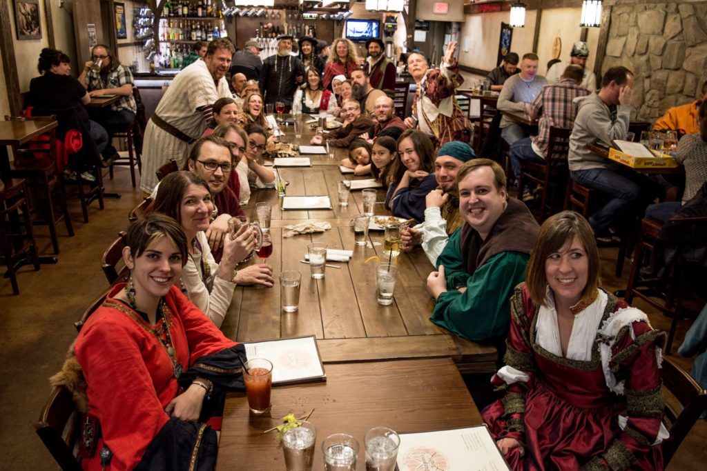 People in garb at a restaurant after an event