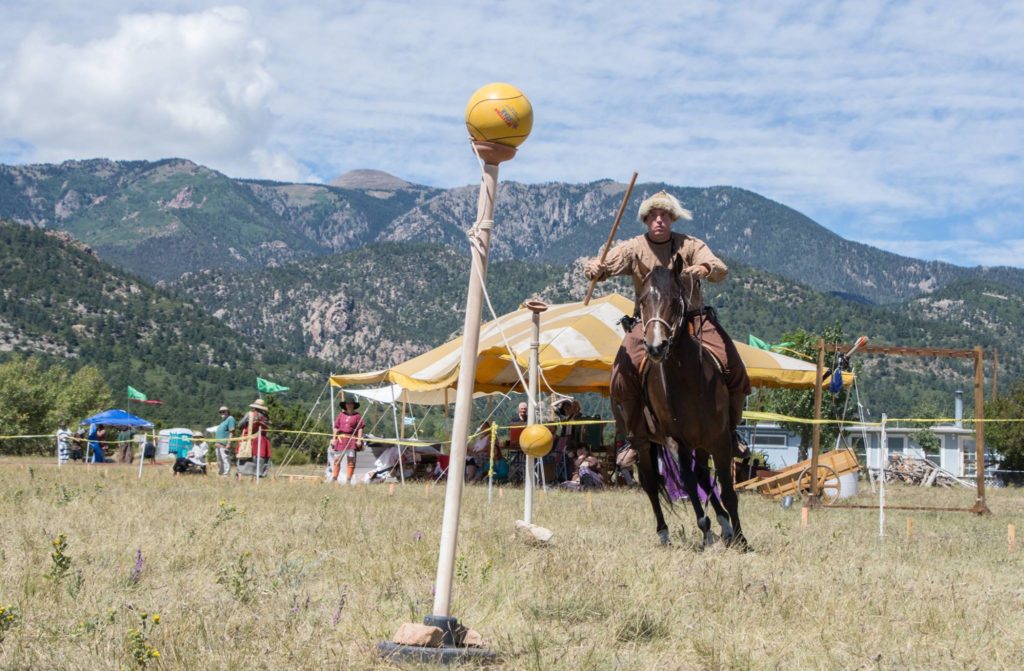 A man on a horse practicing jousting