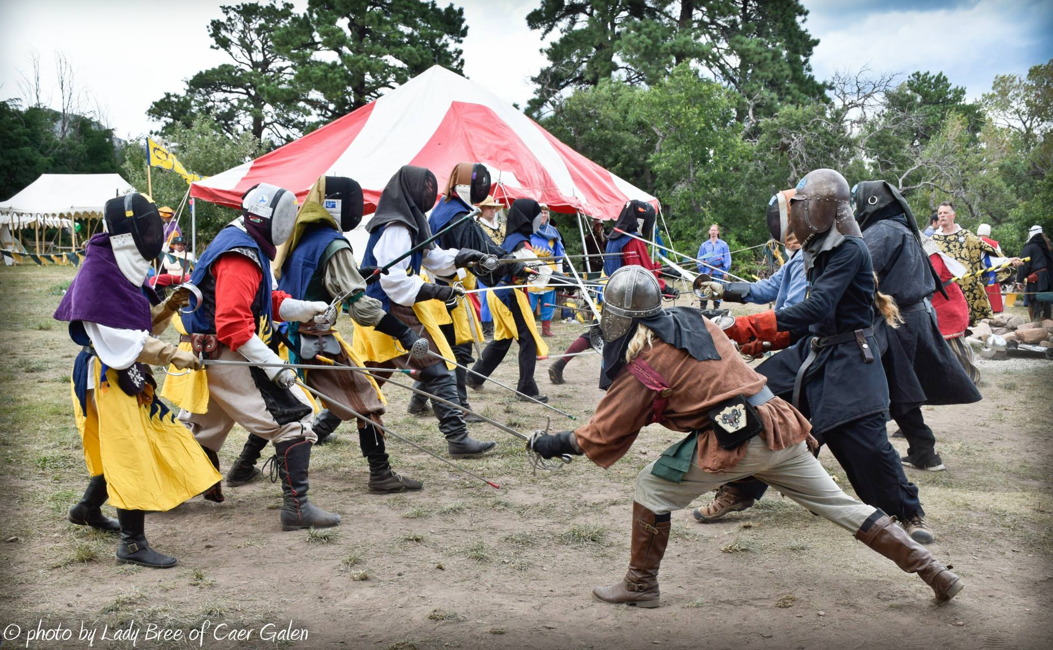 A group of fencers fighting