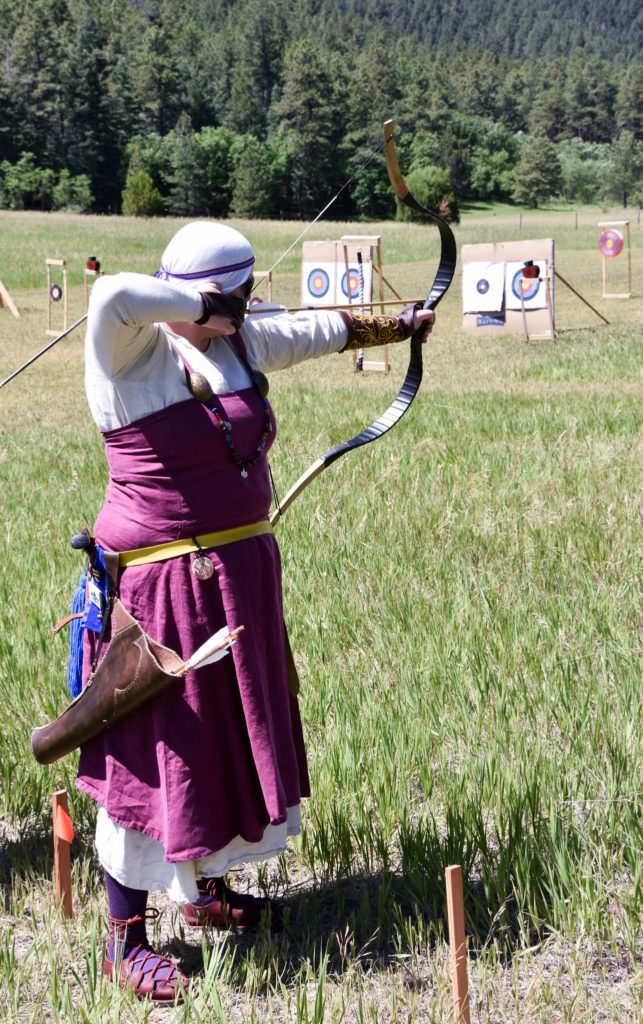 An archer aims at a target
