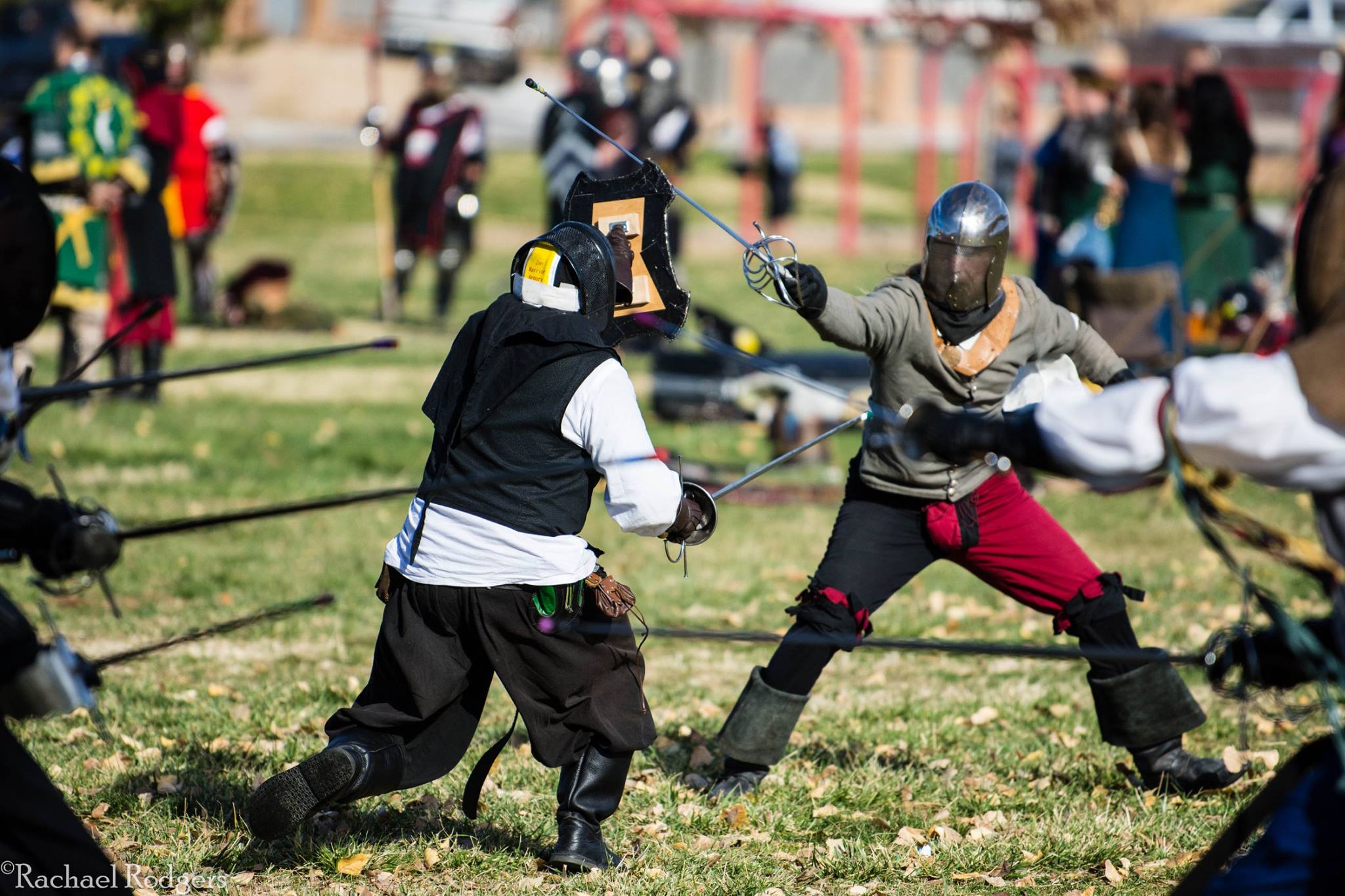 Fencers lunge at each other